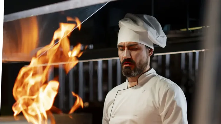 chef-cooking-kitchen-while-wearing-professional-attire.jpg